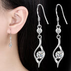 Csavart lógós fülbevaló whitegold